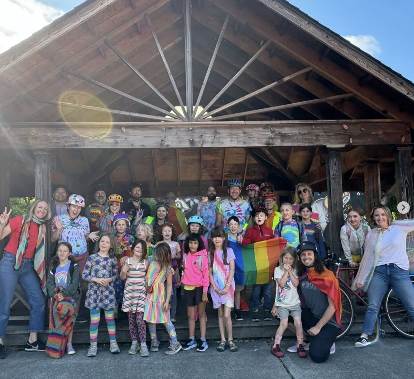 A colorful crowd of kids and families gathered at the gazebo